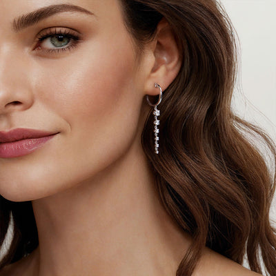 Graduating Diamond Dangling Earrings in White Gold by Gabriel & Co.