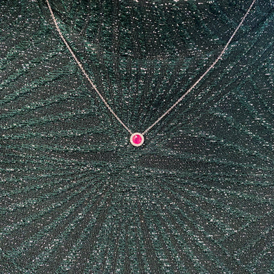 Ruby and Diamond Halo Pendant in White Gold