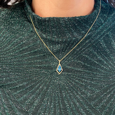 Blue Topaz and Diamond Pendant in Yellow Gold