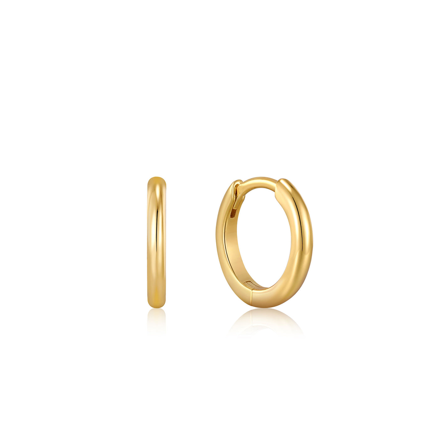 Smooth Huggie Hoops in Yellow Gold by Ania Haie